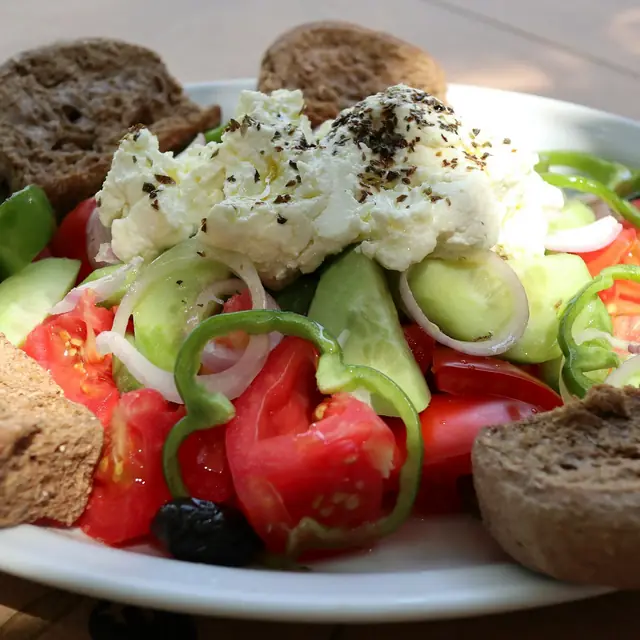 Dakos: tomato and cheese on a rusk.