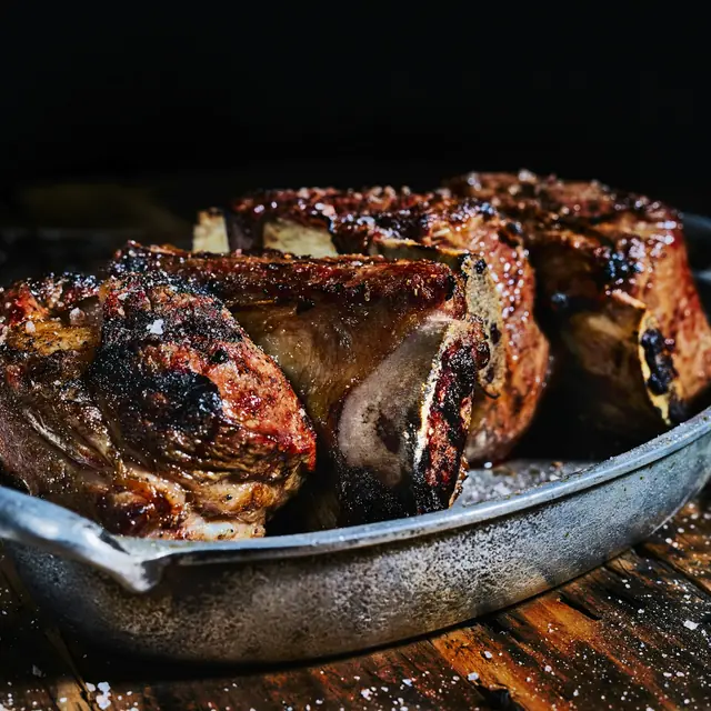Roast lamb in a pan.